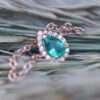 A chain ring with an emerald drop and diamonds around it - Image 5