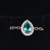 A chain ring with an emerald drop and diamonds around it - Image 3